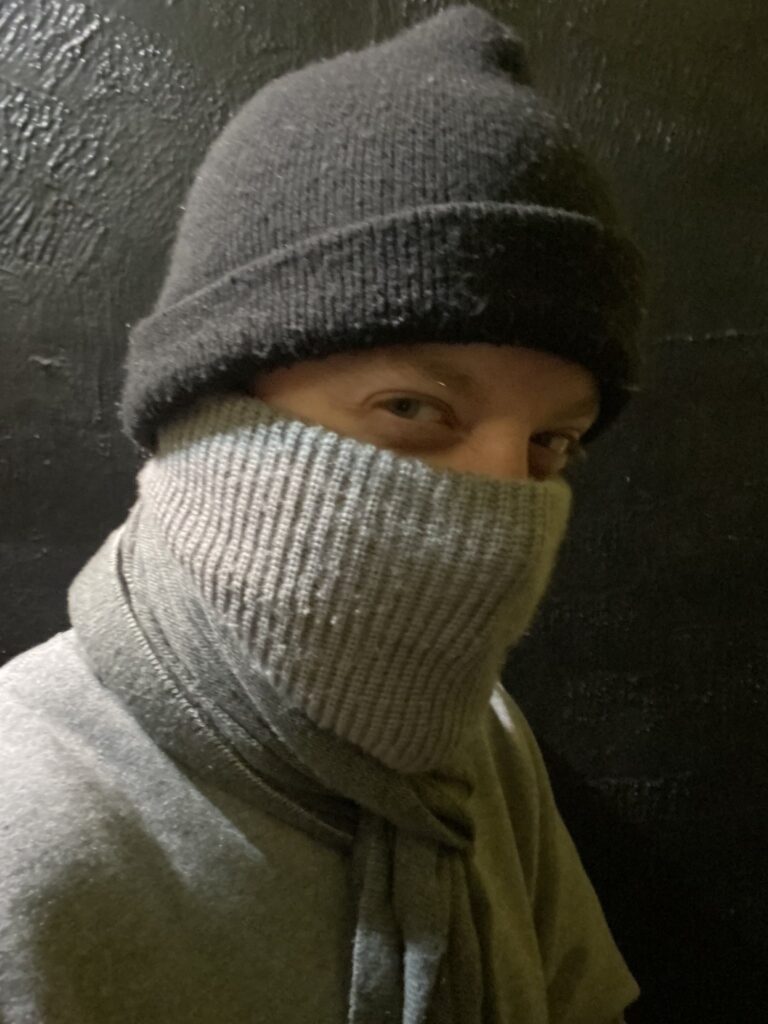 luke wenke face covered winter hat jacket neutral colors